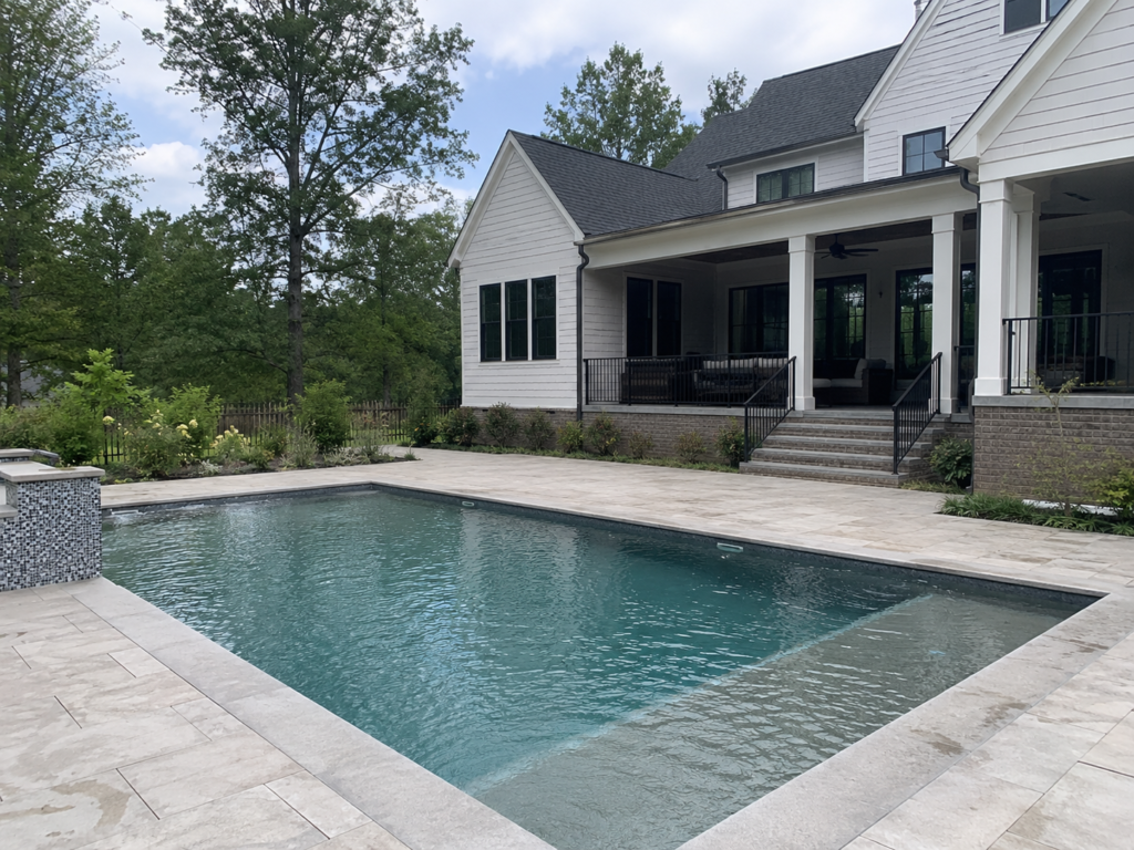 Complete backyard with a pool and bluestone patio in Durham NC