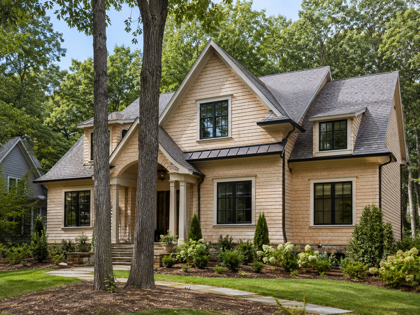 Natural cedar shake shingle siding on a shingle-style home near Chapel Hill NC by Forge Construction Group