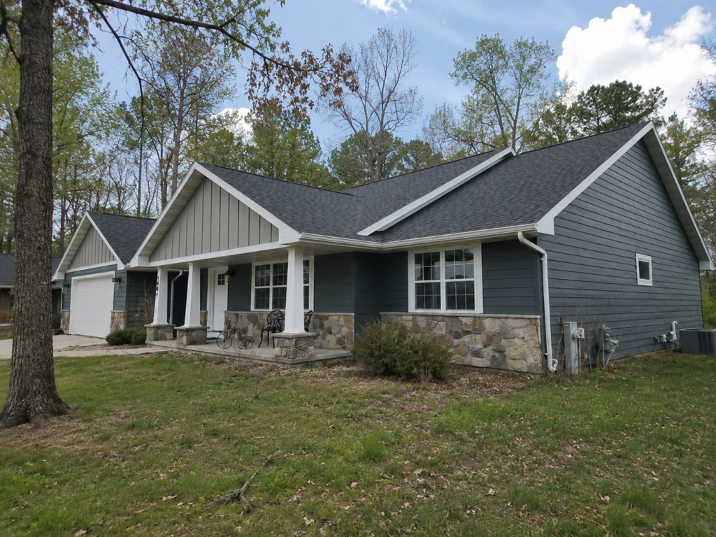 Blue LP SmartSide engineered wood siding with stone skirt on a Wake Forest NC ranch home