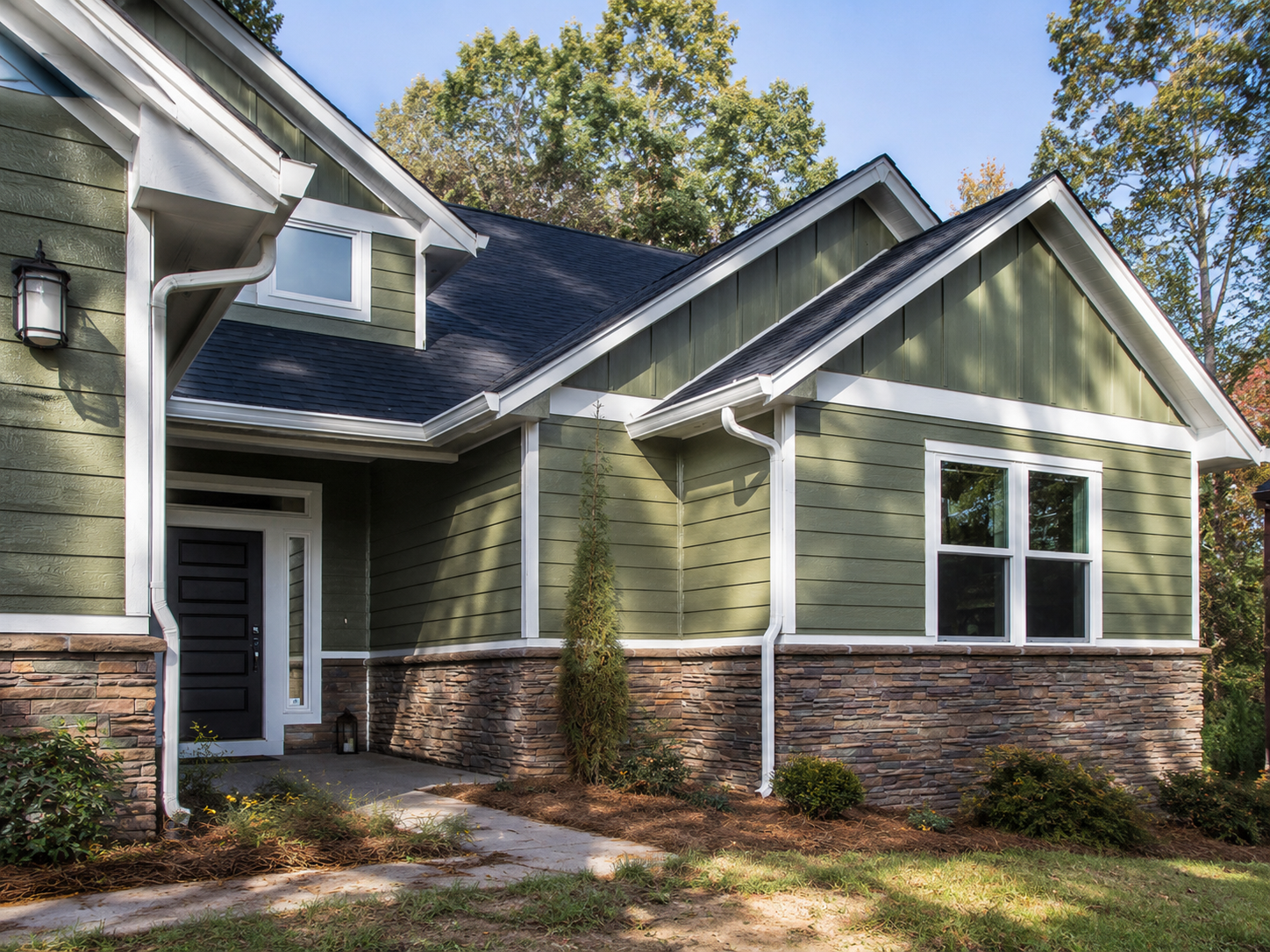 Green LP SmartSide engineered wood siding with stacked stone on a craftsman home in Cary NC