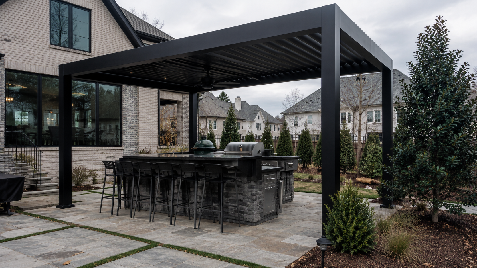 Modern black louvered metal pergola over a patio in Raleigh NC
