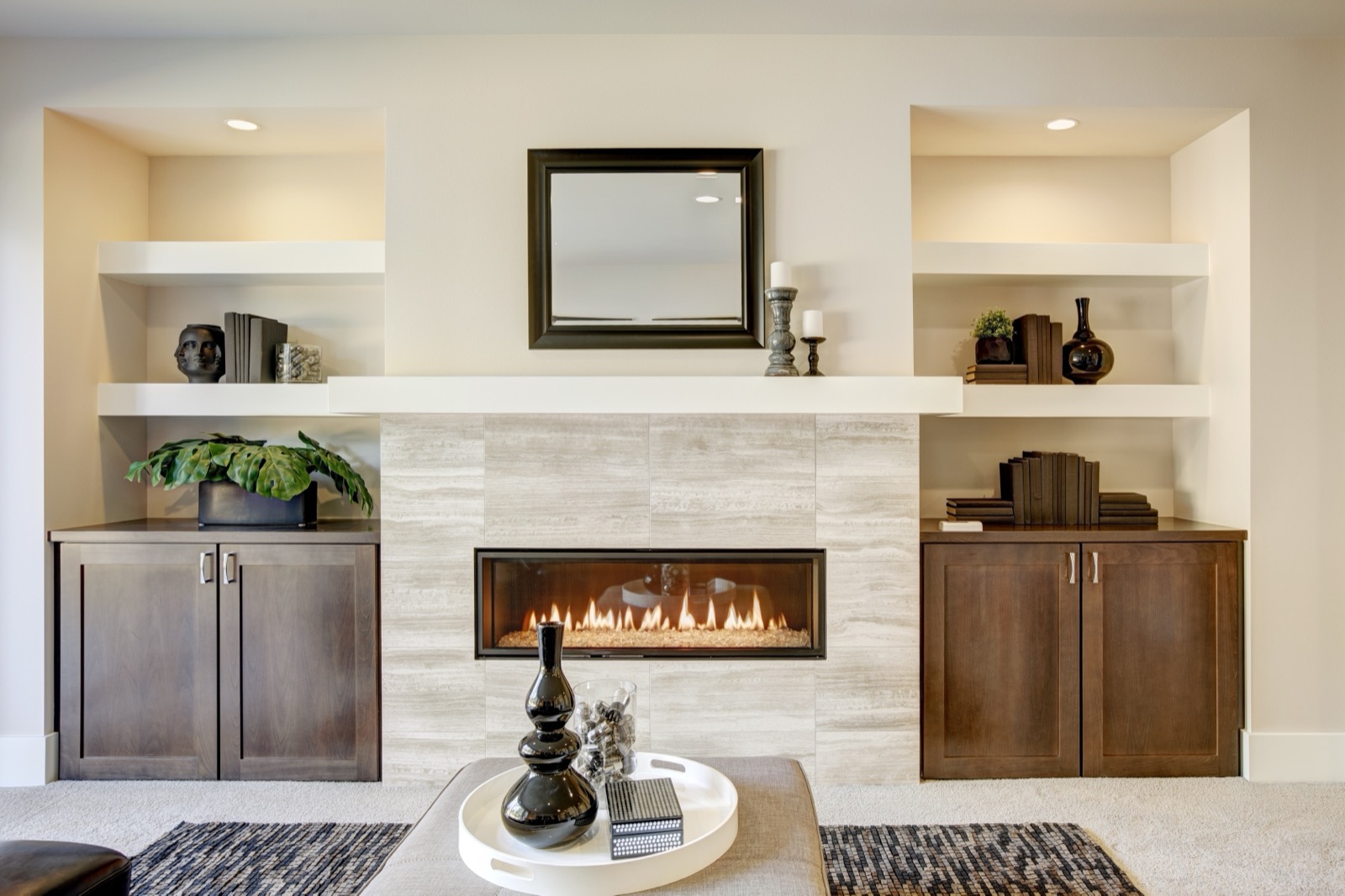 Custom built-ins around a modern linear fireplace