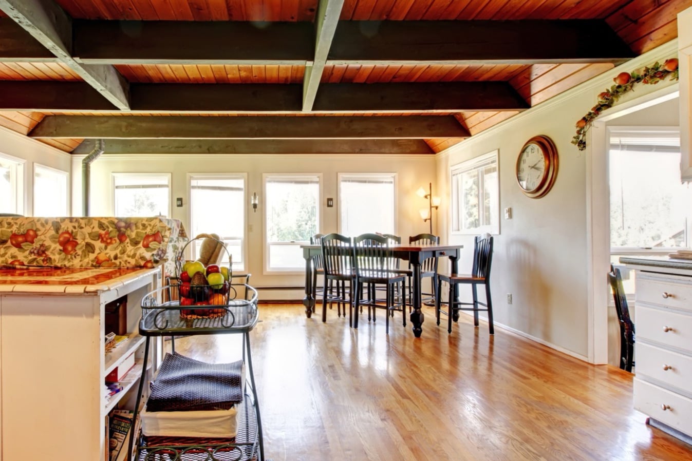 Open kitchen and dining room with a beamed wood ceiling